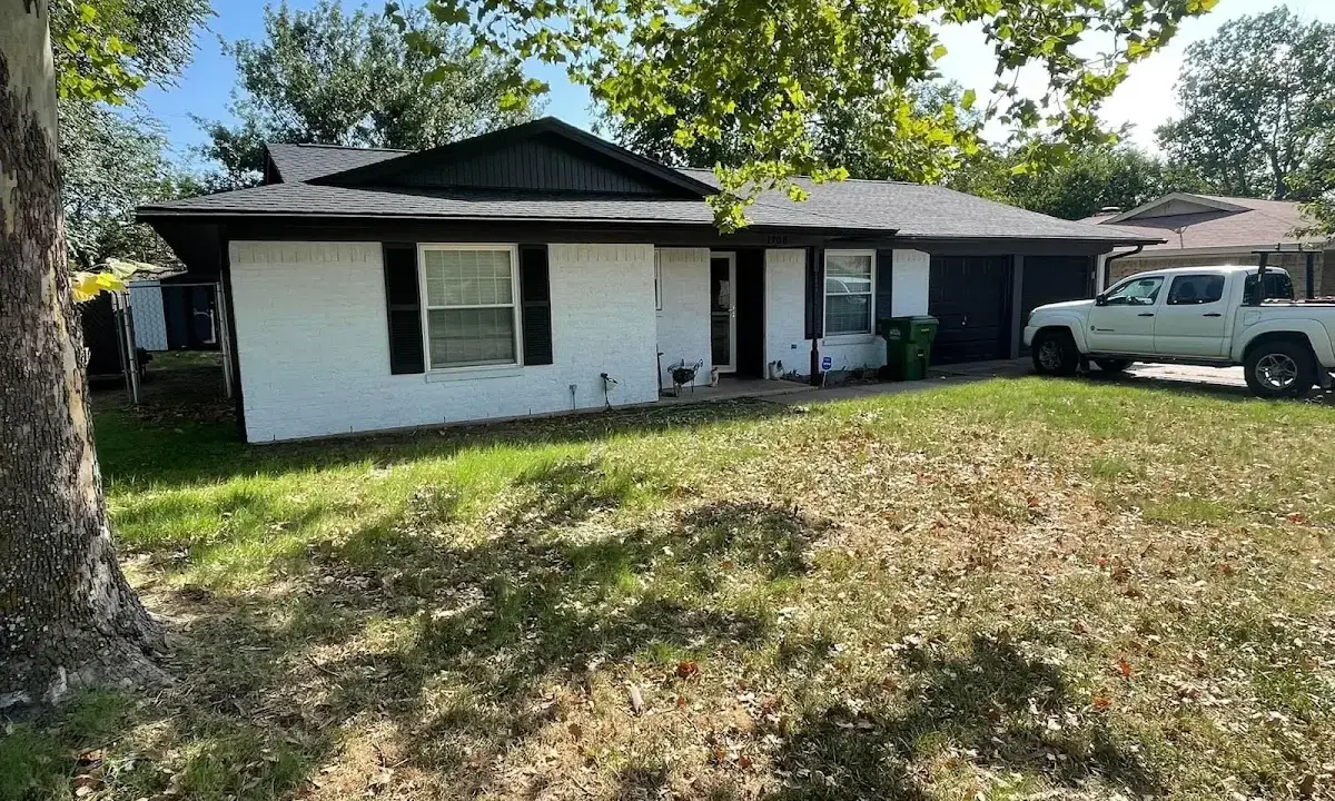 Professional roofing crew working on a residential roof in Pullman